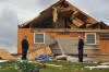 Patricia and David Brown stand in front of what's left of their house, at 6035 Janeway Rd. in Greenback, after a storm caused excessive damage late Wednesday, March 23, 2011. David built the house himself.