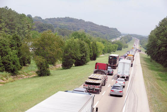 Traffic backs up on Friday at exit 72 on Interstate 75 northbound as vehicles approach the bridge over
Watts Bar Lake in Loudon County. The interstate between exits 72 and 76 will be reduced from two lanes
to one in both directions until bridge repairs are complete, which is scheduled for Oct. 15.