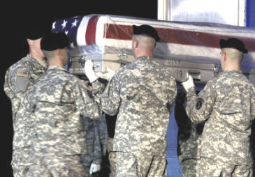 Soldiers carry the transfer case Tuesday with the body of Army Spc. Nathan E. Lillard of Lenoir City. Lillard was killed Sunday in Afghanistan.
