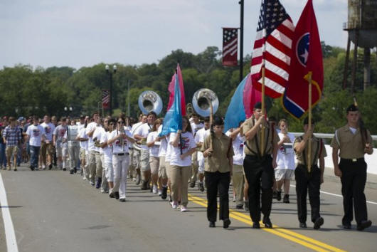 A procession of volunteers who took part in Loudon Bridge Day walk across the Veterans Memorial-John Duncan Bridge on Sunday, September 11, 2011. 
  
 (Saul Young/News Sentinel)
